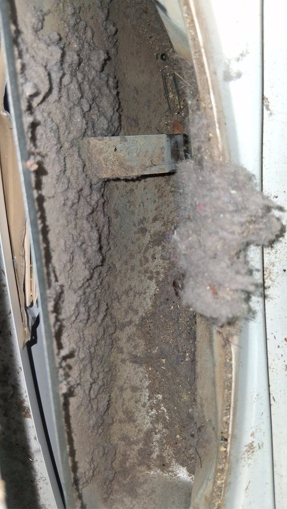Severe dirt buildup inside ducts before air duct cleaning in Oakland, CA